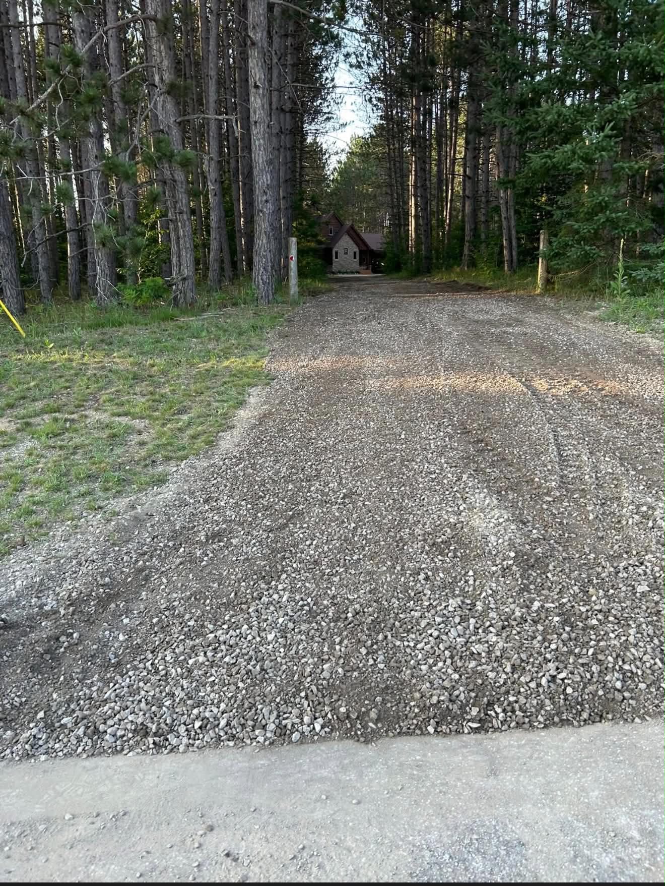 The same driveway after professional regrading and fresh gravel